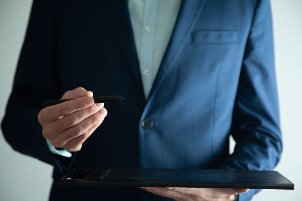 istock man hand tablet with pen in screen 1241927839