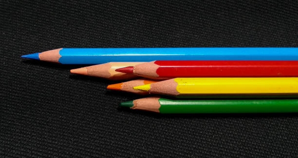 istock Isolated colored pencils on a black background 1241935937
