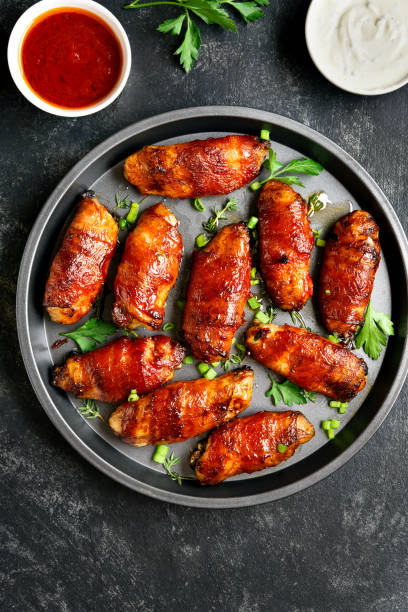 istock Bacon wrapped grilled chicken wings 1241938092
