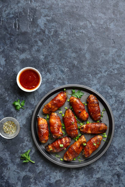 istock Bacon wrapped grilled chicken wings 1241938095