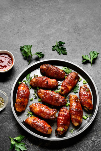 istock Bacon wrapped grilled chicken wings 1241938106