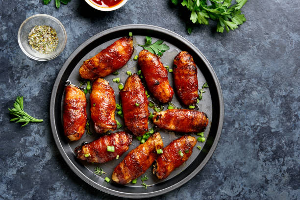 istock Bacon wrapped grilled chicken wings 1241938114
