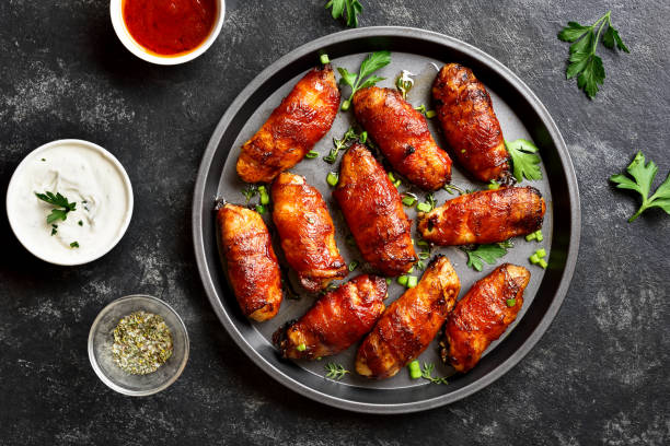 istock Bacon wrapped grilled chicken wings 1241938119