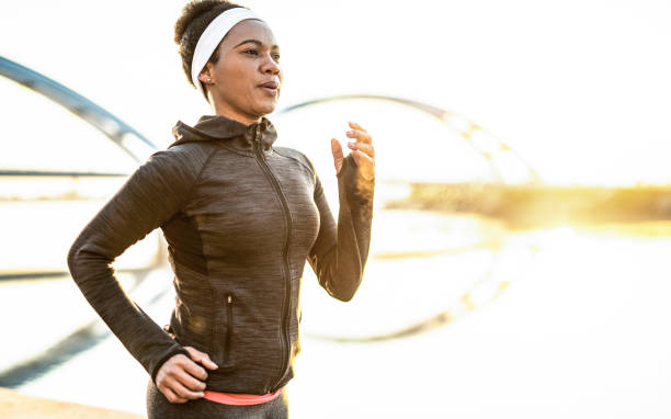 istock Athletic Woman Running Outdoors 1241949175