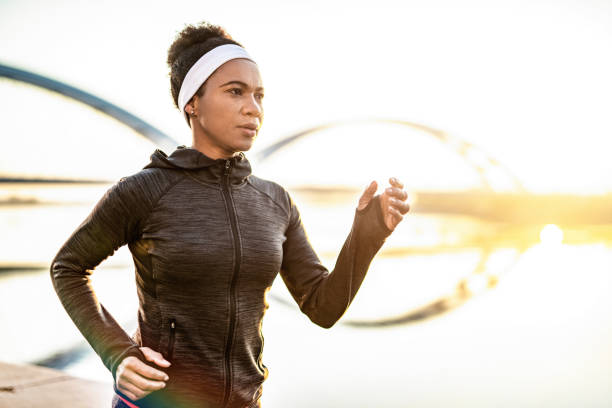 istock Athletic Woman Running Outdoors 1241949752