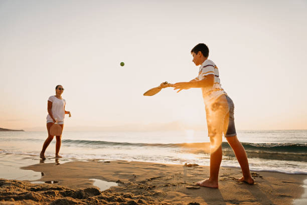 istock Friends playing beach tennis 1241969689