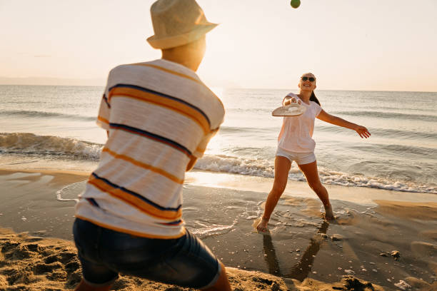 istock Friends playing beach tennis 1241970769