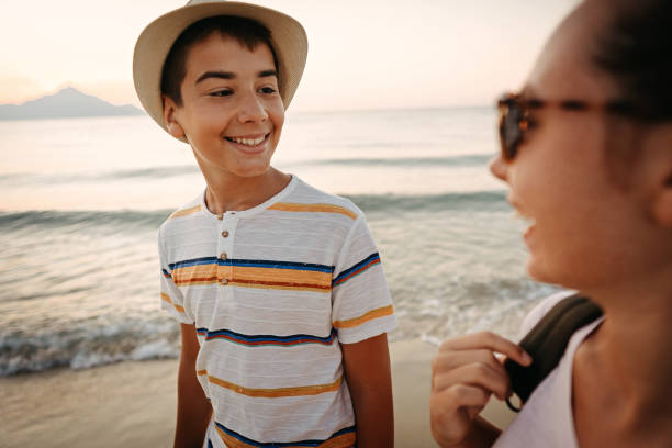 istock Friends walking on the beach 1241972155