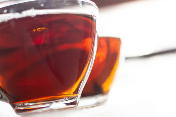 istock 2 chinese tea water in cup glass on dish and white table background 1241988949