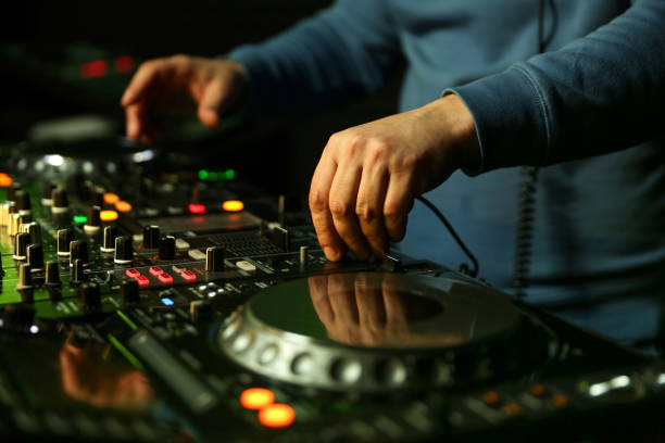istock dj's hands are mixing music on digital turntable 1241990052