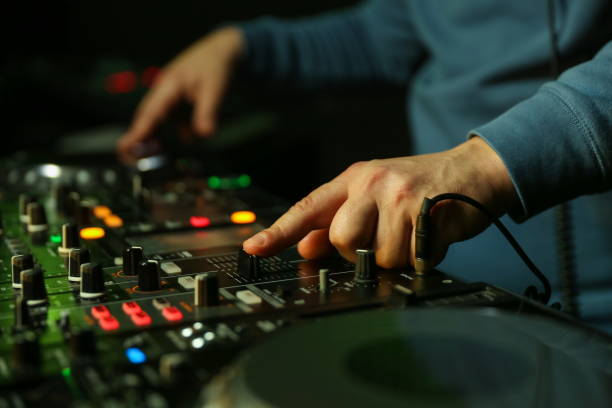 istock dj's hands are mixing music on digital turntable 1241990053