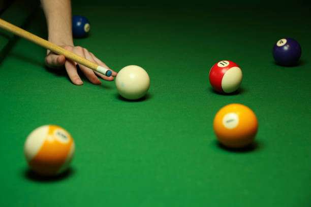istock billiard background with color balls and cues 1241990612