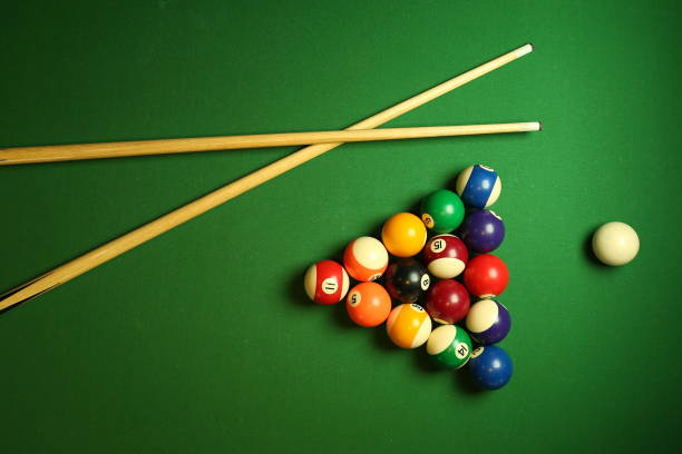 istock billiard background with color balls and cues 1241990631