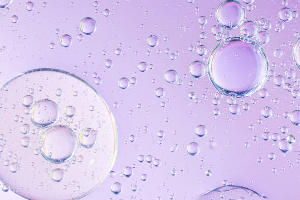 istock Abstract molecule sctructure. Water bubbles. Macro shot of air or molecule. Abstract pink and orange red background. Space or planets abstract background. Selective focus 1241991031