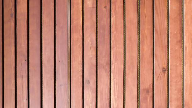 istock Wooden old brown vertical railing on the whole background 1242011316