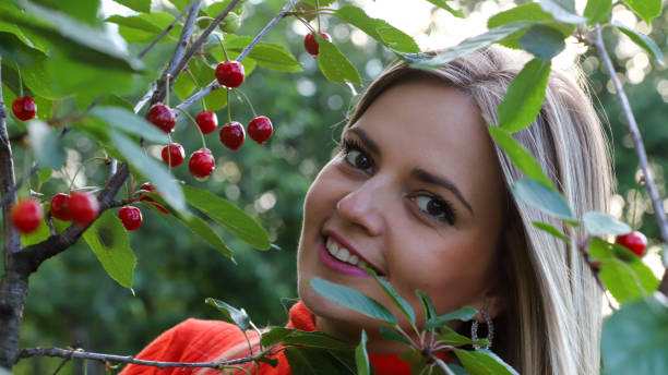 istock Beautiful Girl Checking Cherries 1242016224