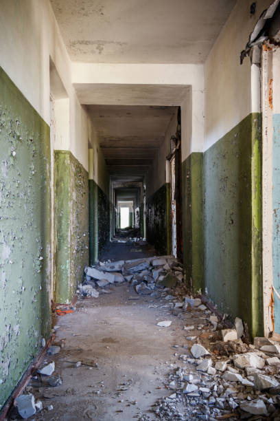 istock Long corridor of ruined abandoned house 1242019581