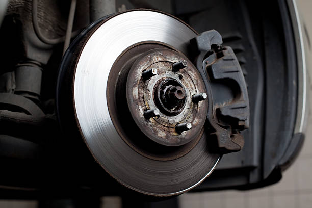 istock Brake disc and pads closeup 124202458