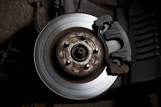 istock Brake disc and pads closeup 124202675