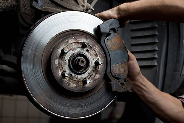 istock Car mechanic repair brake pads 124202800
