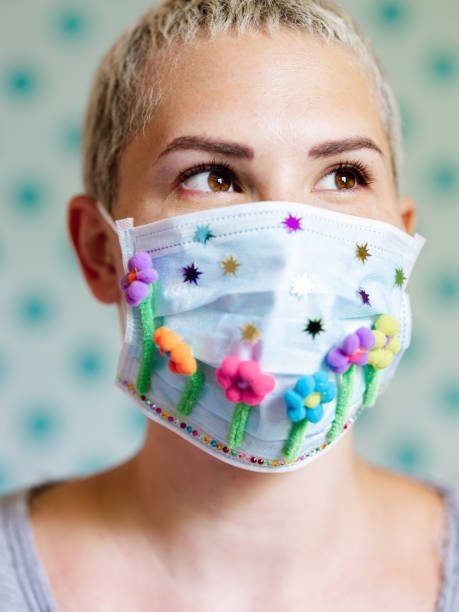 istock Young woman with artsy face mask 1242030745