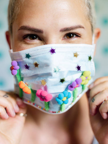 istock Young woman with artsy face mask 1242034419