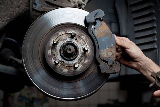 istock Car mechanic repair brake pads 124203557