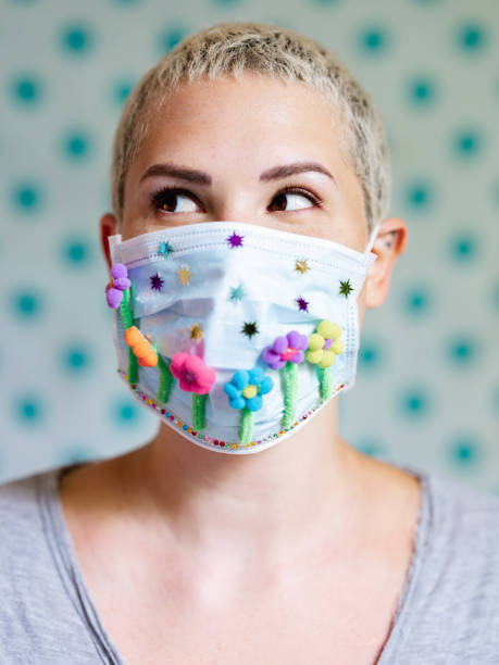 istock Young woman with artsy face mask 1242036511