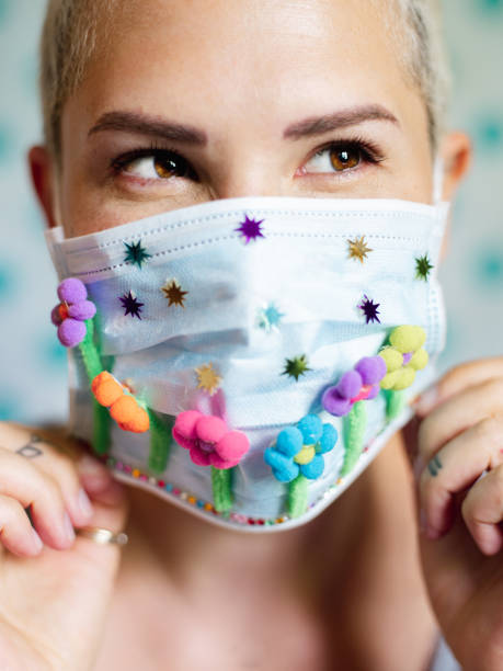 istock Young woman with artsy face mask 1242037705
