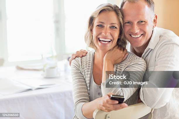 Portrait Of Happy Couple At The Breakfast Table Stock Photo - Download Image Now - Couple - Relationship, Happiness, 45-49 Years