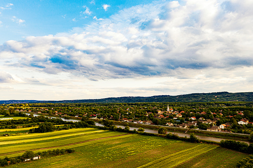 Aerial view over autumn agricultural fields and old village,drone photography.