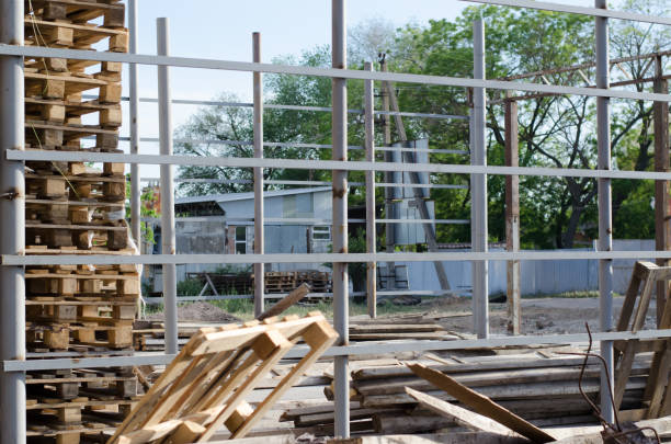 istock Construction of a welded iron structure. Construction of a building from metal structures 1242070959