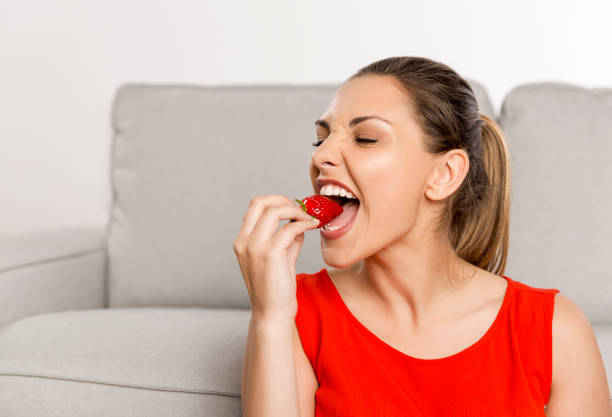 istock She loves strawberries 1242071504