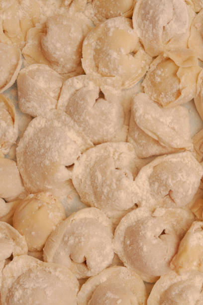 istock Homemade dumplings are put together on a Board in the kitchen 1242079521