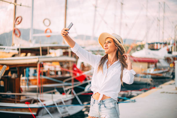 istock Woman Taking Selfie in Marina 1242082243