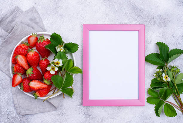 istock Strawberry with leaves and flowers 1242082795