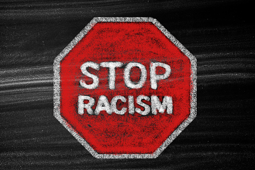 RACISM/ Stop sign concept