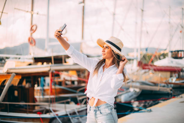 istock Woman Taking Selfie in Marina 1242083882