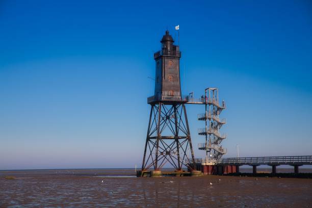 istock Obereversand lighthouse in Dorum-Neufeld with low tide 1242101576