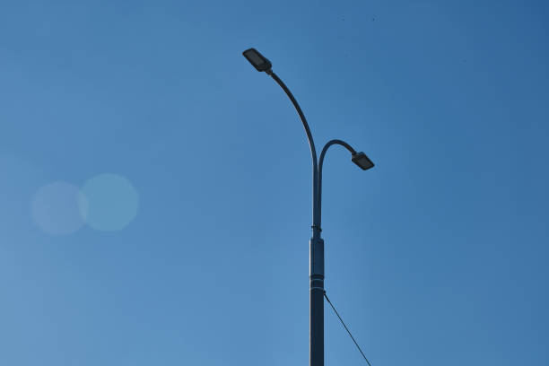 istock Under the blue sky, street lights and cables 1242110727