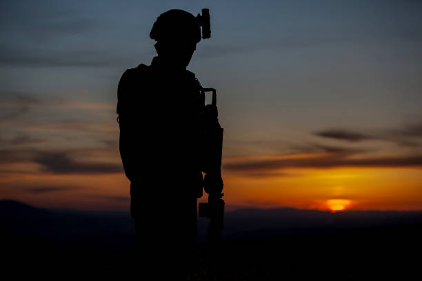 istock silhouette of soldier at sunset 1242112894