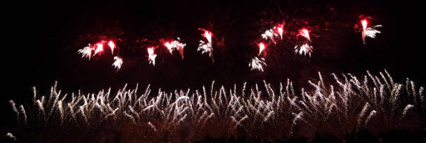 istock Colourful Abstract Fireworks in the night sky, isolated on black background, panoramic 1242112910