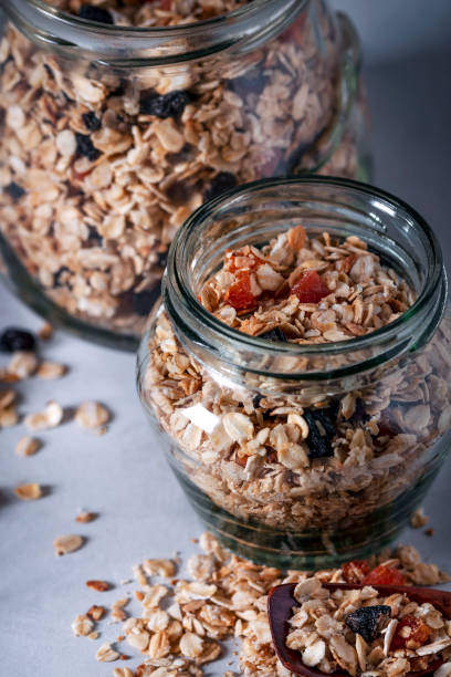 istock Healthy breakfast, raisins, dried apricots, nuts, oatmeal 1242116177