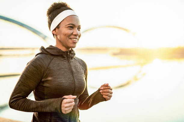 istock Athletic Woman Running Outdoors 1242116699