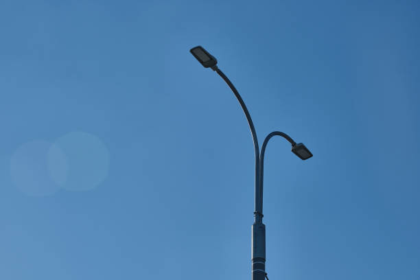 istock Under the blue sky, street lights and cables 1242117284