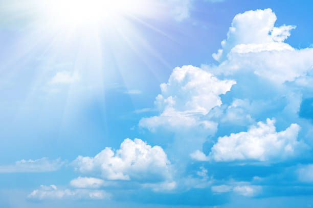istock Blue sky with white clouds and sun. Nature background 1242126224