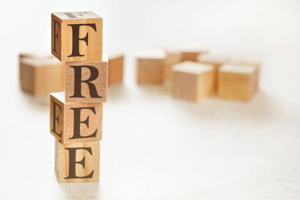 istock Four wooden cubes arranged in stack with word FREE on them, space for text / image at down right corner 1242126315