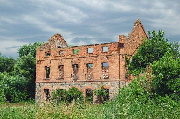 istock Old abandoned ruined building without a roof and windows 1242129762