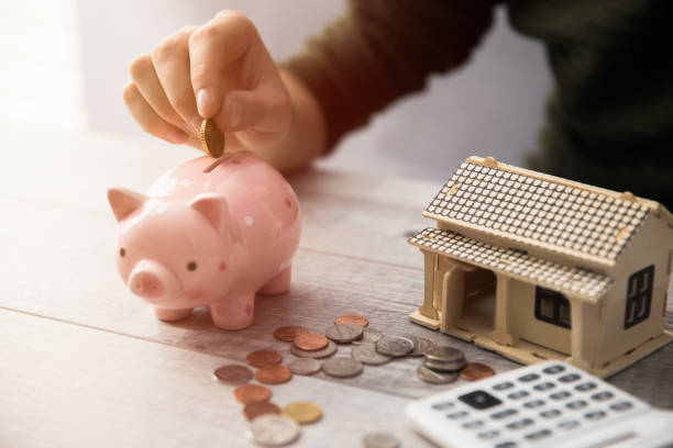 istock man hand coins with piggy bank 1242151990