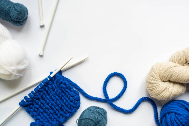 istock top view of wool yarn and knitting needles on white background 1242154211